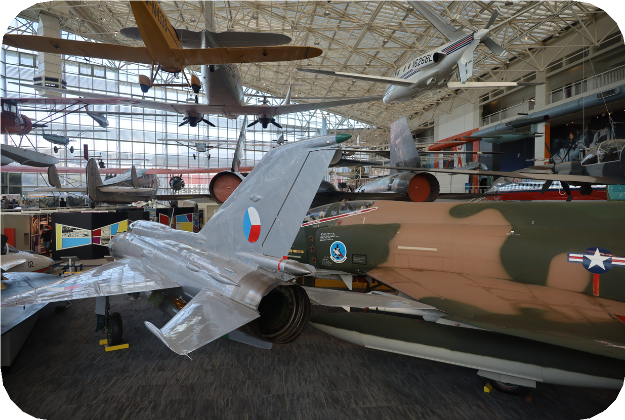 A group of airplanes in a buildingAI-generated content may be incorrect.